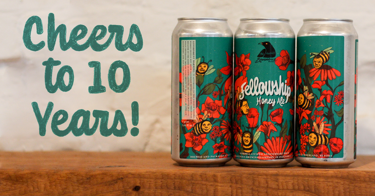 Four cans of Fellowship Honey Ale with illustrated floral and bee labels on a wooden table, featuring text ‘Cheers to 10 Years!’ celebrating Norbella’s 10th anniversary collaboration beer.